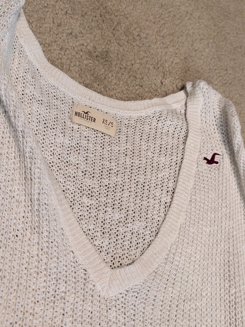 Hollister Women's White V-Neck Open Knit Sweater with Maroon Logo